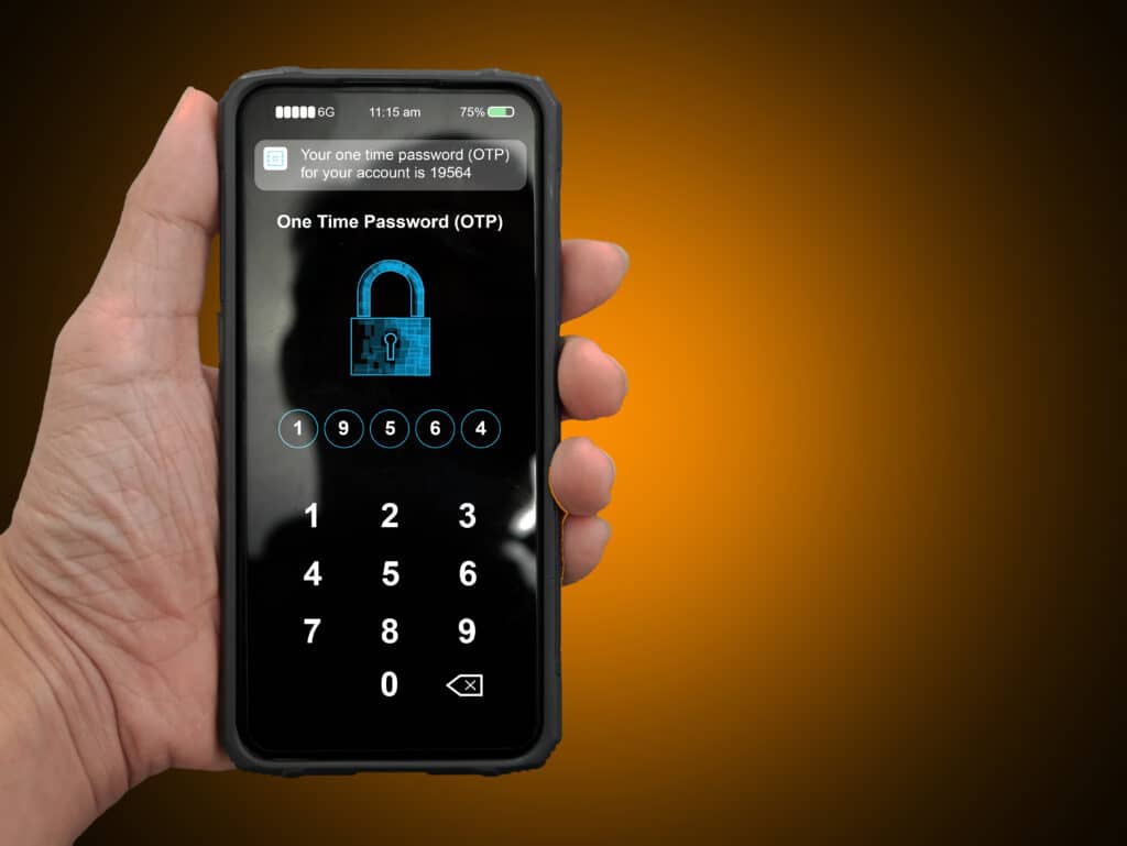 A hand holding a smartphone with filled up one time password for the validation process, Mobile OTP secure verification method, 2-Step authentication concept.